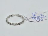 a ring with a price tag on it sitting on a table
