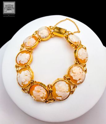 yellow and white shell bracelet with gold tone chain