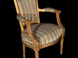 an image of a chair with a striped upholstered back and arms