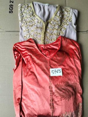 a pair of pink and white blouses with gold embroiderys