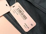 a label on the back of a jacket with a barcode on it