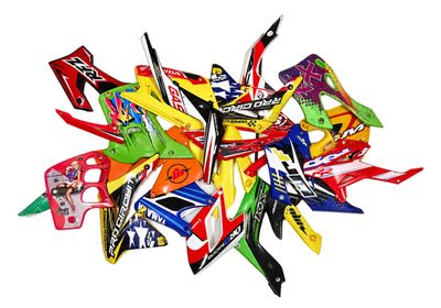 a pile of assorted candy on a white surface
