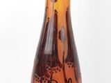 a brown vase with a design on it on a white background