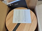 a box that has a wooden plate in it