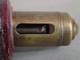 a close up of a brass object with a hole in it