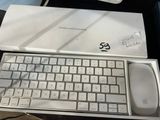 a white keyboard and mouse in a box on a table