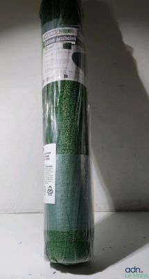 a roll of green grass that is wrapped in plastic