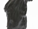 statue of a man holding a bird in his hand