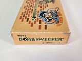 a box of bomb sweeper sitting on a white surface