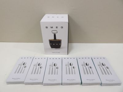 six boxed boxes of coffee sit on a table next to a cup of coffee