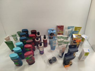 many different types of skin care products displayed on a table