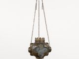 an old brass hanging lamp with a chain hanging from it ' s side