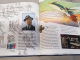 an open book with a picture of a man in a hat on it