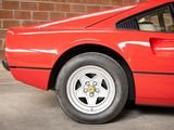 a red sports car that is parked in a garage