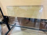 a glass table with a glass top in a room