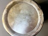 a silver plate that is sitting on a table