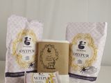 a couple of bags of soap sitting on top of a table