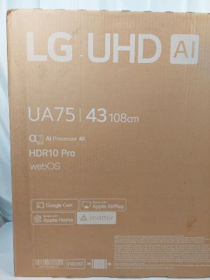 a box that is sitting on a bed with a laptop on it
