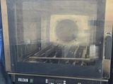 an image of a toaster oven sitting on top of a table