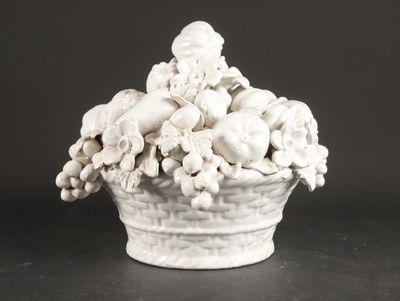 a white vase filled with skulls and flowers on a table