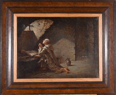 an old painting of a man reading a book in a cave