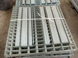 a lot of steel bars stacked on top of each other