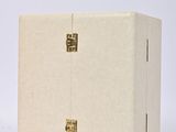a white box with a gold design on it