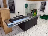 tiled floor in a store with a counter and a glass display case
