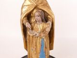 an image of a statue of a woman holding a child in her arms