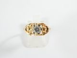 an image of a gold and diamond ring on a white surface