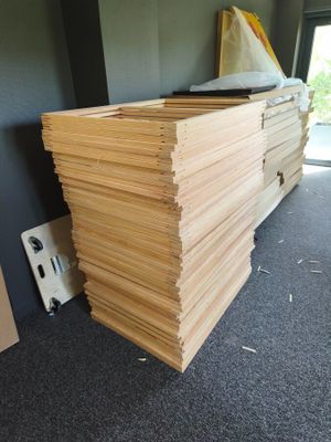 a stack of wood sitting on the floor in a room