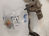two valves, a hose, and a plastic bag on the table
