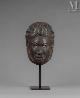 a bronze head of a man with a beard on a stand