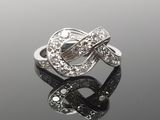 an image of a ring with diamonds on a reflective surface