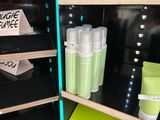 many bottles of skin care on the shelves in the store