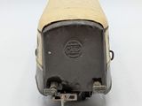 a small toy train car on a white surface
