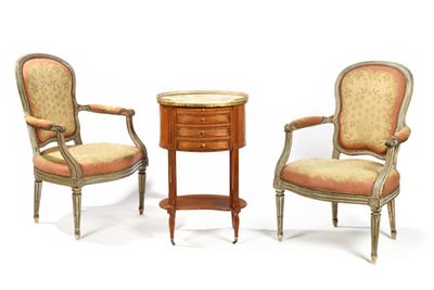 two chairs and a table with a small table on top of it