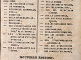 an old book with french writing on it sitting on a table