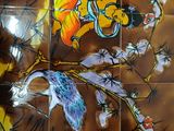 a picture of a tiled wall with birds and flowers on it