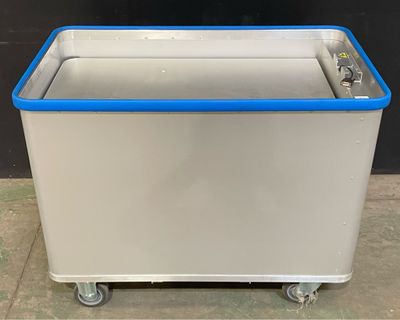 an image of a white and blue ice chest sitting on top of a tile floor