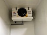 a white toilet with a black bowl on top of it
