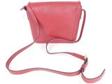 red leather cross body bag with shoulder strap on a white background