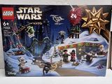 a box of lego star wars sets on a table