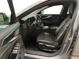 the interior of a car with the door open and the driver ' s seat up