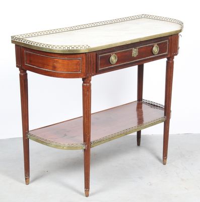 a table with a marble top and a shelf underneath it