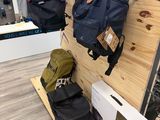 a bike rack with backpacks on it in a store