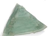 a green glass plate with a triangular design on it
