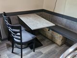 a table and chairs in the corner of a room
