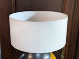 a lamp that is sitting on a table in a room