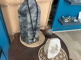 a large rock sitting on a table next to a large rock